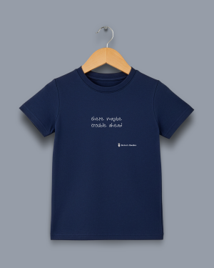 'there maybe trouble ahead' image shows a navy blue coloured kids' t-shirt with white writing on the front