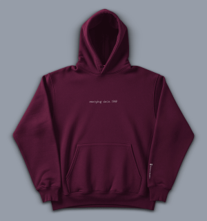 'annoying since 1969' image shows a men's hoodie in burgundy with white writing
