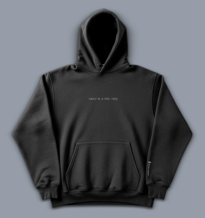 'based on a true story' image shows a black coloured hoodie with white text on the front