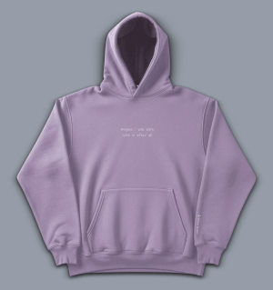 'maybe I was born with it after all' image shows a lilac coloured hoodie with white text on the front